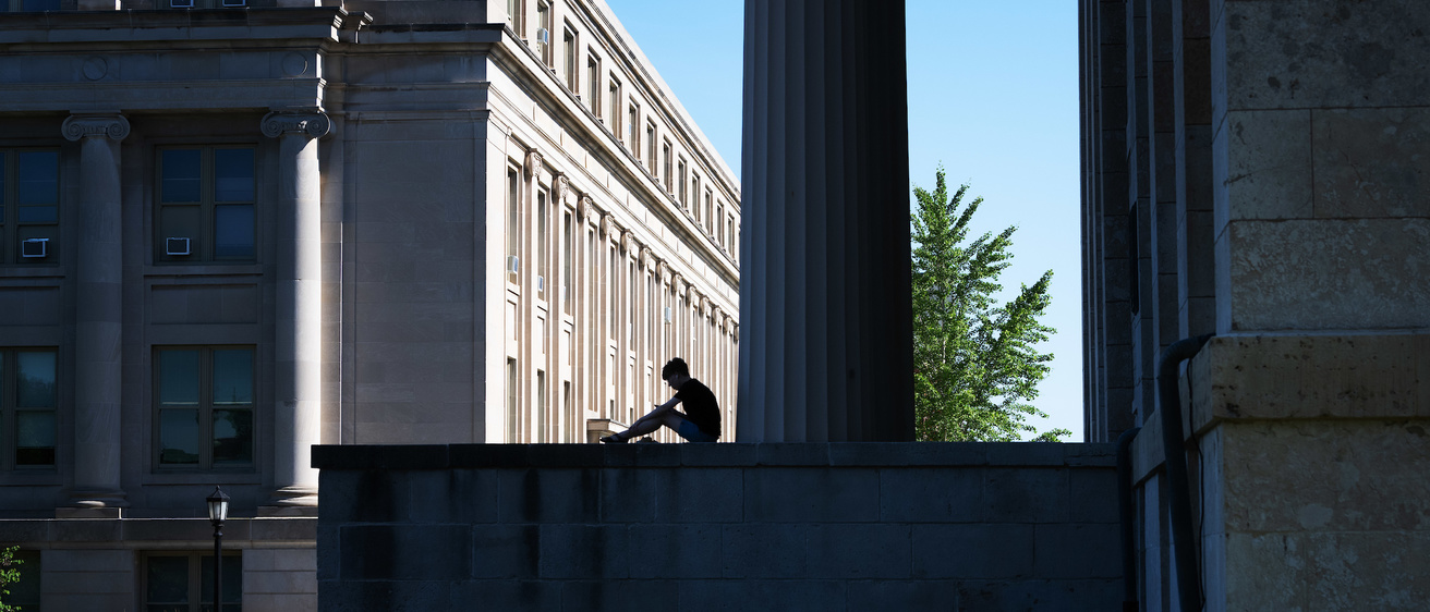 Student Sitting on Old Capitol Steps
